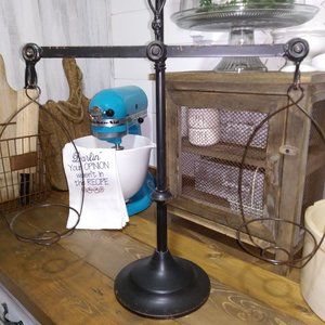 Farmhouse scale decor with metal baskets